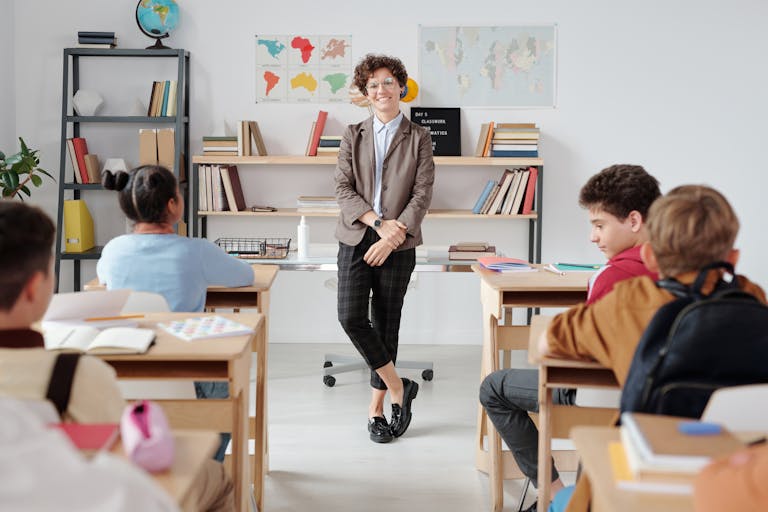 A Teacher Standing in the Classroom - SlidesGo Tools for Education